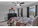 Bedroom features a large dark dresser and a window with natural light and a ceiling fan at 176 Butler Rd, Brooks, GA 30205