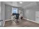 Bedroom with desk and computer setup, bright window, and hardwood floors at 176 Butler Rd, Brooks, GA 30205
