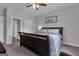 A spacious bedroom with a large bed, neutral walls, and carpet flooring at 176 Butler Rd, Brooks, GA 30205