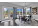 Bright dining area with french doors features a wooden table, and an area rug at 176 Butler Rd, Brooks, GA 30205