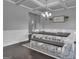 Traditional dining room with wainscotting, dark wood floors, and a stylish chandelier at 176 Butler Rd, Brooks, GA 30205