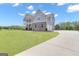 Beautiful home with stone accents, a two-car garage, and a well-maintained lawn at 176 Butler Rd, Brooks, GA 30205