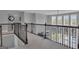 Open upstairs foyer area with dark wood railing overlooking the living room at 176 Butler Rd, Brooks, GA 30205