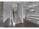 Grand foyer with hardwood floors, staircase, and elegant dining area at 176 Butler Rd, Brooks, GA 30205