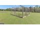 Exterior shot of a spacious, fenced-in garden with rich soil and a variety of plant seedlings at 176 Butler Rd, Brooks, GA 30205