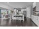 Bright, open kitchen with a large island, stainless steel appliances, and an adjacent dining area at 176 Butler Rd, Brooks, GA 30205