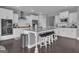 Spacious kitchen boasts a large island with seating and stainless steel appliances at 176 Butler Rd, Brooks, GA 30205