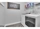 A utility room with washer, dryer, and shelving for supplies at 176 Butler Rd, Brooks, GA 30205