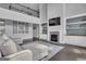 Open living room features a fireplace, built-in shelving, and dark wood floors at 176 Butler Rd, Brooks, GA 30205