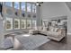 Bright and airy living room with soaring ceilings and large windows at 176 Butler Rd, Brooks, GA 30205