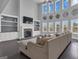 Spacious living room featuring a fireplace, high ceilings, and large windows at 176 Butler Rd, Brooks, GA 30205
