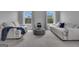 Comfortable living room area showcasing seating arrangement with chairs and ottoman at 176 Butler Rd, Brooks, GA 30205
