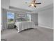 Spacious main bedroom with trey ceiling, fan, carpet, and windows with outside views at 176 Butler Rd, Brooks, GA 30205