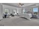 Expansive main bedroom featuring a sitting area, tray ceiling, and natural light at 176 Butler Rd, Brooks, GA 30205