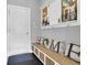 Cozy mudroom includes a bench with storage underneath and convenient coat hooks, combining functionality with style at 176 Butler Rd, Brooks, GA 30205
