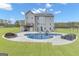 Backyard pool with patio, furniture, and fire pit at 176 Butler Rd, Brooks, GA 30205