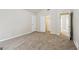 A spacious bedroom featuring a closet and glimpses of other rooms in the house at 5296 Golfcrest Cir, Stone Mountain, GA 30088