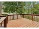 Spacious wooden deck overlooks a serene backyard with lush greenery and mature trees at 5296 Golfcrest Cir, Stone Mountain, GA 30088