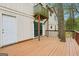 Large deck featuring sliding glass door entry and trees growing up through the structure at 5296 Golfcrest Cir, Stone Mountain, GA 30088