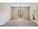 Open and airy dining area featuring a chandelier and natural light through a window at 5296 Golfcrest Cir, Stone Mountain, GA 30088