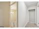 Hallway with neutral carpet, chandelier view, and white trim at 5296 Golfcrest Cir, Stone Mountain, GA 30088