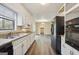 Updated kitchen featuring white cabinets, granite countertops, and stainless steel appliances, with ample natural light at 5296 Golfcrest Cir, Stone Mountain, GA 30088