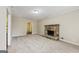 Inviting living room with stone fireplace, neutral carpet, and soft lighting, creating a warm and comfortable atmosphere at 5296 Golfcrest Cir, Stone Mountain, GA 30088