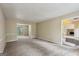 Open living room with carpeted floors and white molding at 5296 Golfcrest Cir, Stone Mountain, GA 30088