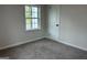 Bright bedroom with neutral paint and carpet, and a double-hung window at 1751 S Olympian Way, Atlanta, GA 30310