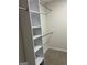 Walk-in closet features custom white shelving and plenty of storage space at 1751 S Olympian Way, Atlanta, GA 30310