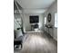 Inviting foyer showcasing a stylish console table and a modern staircase with black metal railings at 1751 S Olympian Way, Atlanta, GA 30310