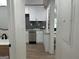 Bright kitchen featuring stainless steel appliances, white cabinets, and a stylish sink with a view at 1751 S Olympian Way, Atlanta, GA 30310