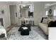 Cozy living space with contemporary decor, including a sleek coffee table and neutral-toned sofa at 1751 S Olympian Way, Atlanta, GA 30310