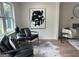 Comfortable living room boasting stylish seating, a decorative rug, and eye-catching modern artwork at 1751 S Olympian Way, Atlanta, GA 30310