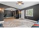 Basement with luxury vinyl plank flooring, neutral paint, archways, and a fireplace feature at 105 Honey Creek Rd, Mcdonough, GA 30252