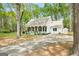 Charming home with a cozy front porch, black shutters, and well manicured landscaping at 105 Honey Creek Rd, Mcdonough, GA 30252