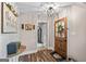 Inviting foyer with wood-look flooring, decorative art, and a view into the home's interior at 105 Honey Creek Rd, Mcdonough, GA 30252