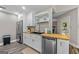 An eat-in kitchen features modern appliances, floating shelves, and wood countertops at 105 Honey Creek Rd, Mcdonough, GA 30252