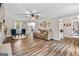 Spacious living room with hardwood floors, comfortable seating, and a view of the backyard at 105 Honey Creek Rd, Mcdonough, GA 30252