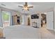 A bright and spacious bedroom with a ceiling fan, exterior doors, and a walk-in closet at 105 Honey Creek Rd, Mcdonough, GA 30252