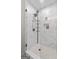 This modern shower features tiled walls, a shower caddy, and a decorative niche at 105 Honey Creek Rd, Mcdonough, GA 30252