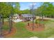 Beautiful aerial view showcasing the home's large lot, landscaping, and peaceful surroundings at 155 Duncans Mill Dr, Locust Grove, GA 30248