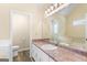 Bathroom features a spacious vanity with sink, toilet, and a luxurious bathtub for relaxation and comfort at 155 Duncans Mill Dr, Locust Grove, GA 30248