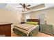 Comfortable bedroom with a cozy bed, neutral tones, and ample natural light for a serene atmosphere at 155 Duncans Mill Dr, Locust Grove, GA 30248