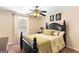 Inviting bedroom with a comfortable bed, soft lighting, and coordinated decor for a relaxing ambiance at 155 Duncans Mill Dr, Locust Grove, GA 30248