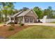 Beautiful home featuring an attached two car garage and lush landscaping in a quiet neighborhood at 155 Duncans Mill Dr, Locust Grove, GA 30248