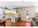 Well-lit kitchen features white cabinetry, granite counters, and a breakfast bar with seating for casual dining at 155 Duncans Mill Dr, Locust Grove, GA 30248