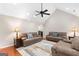 Spacious living room with vaulted ceiling and hardwood floors at 155 Duncans Mill Dr, Locust Grove, GA 30248