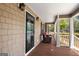 Inviting covered porch with stylish seating, offering a relaxing outdoor space at 155 Duncans Mill Dr, Locust Grove, GA 30248
