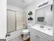 Clean, well-lit bathroom featuring a tub/shower combo and vanity with modern fixtures at 2800 Chelsey Trl, Jonesboro, GA 30236